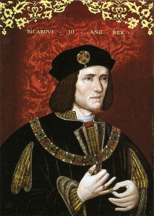 An oil portrait of King Richard III, a white man with shoulder length brown hair. Above him are the words Ricardvs III Ang Rex. The background is a rich red colour decorated with gold at the top. He appears to be placing a ring on the little finger of his right hand.