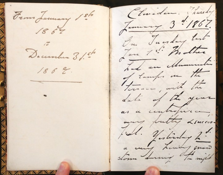 A photograph of Ronald Gower's diary on the first two pages. Handwritten, it reads on the first page 'from January 1st 1867 - December 31st 1867'. The second page is dated January 3rd 1867, followed by an entry in hard to decipher cursive. 