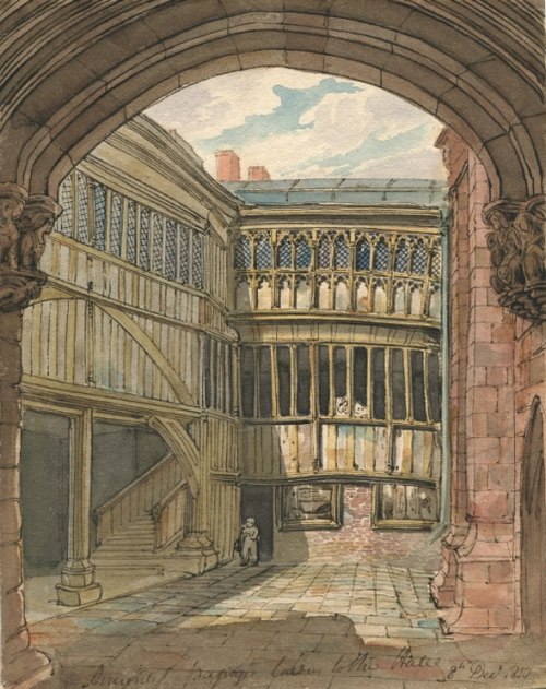 A watercolour painting of the exterior of St Mary's Hall. The picture is framed by a stone arch, where inside is a wooden exterior of the hall, with long narrow windows. On the left under a raised part of the building are stairs leading up into the hall. 