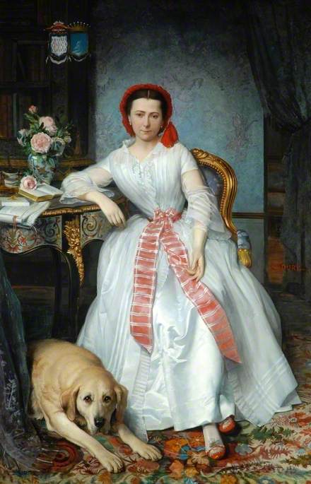 A full-length coloured portrait of Josephine Bowes. Inside an ornate room, with a marble wallpaper behind her and a colourful carpet, she is sitting on a gold chair, with her right elbow leaning on a high table to her right with papers, books and roses in a vase on top. To her right on the floor lays a golden retriever looking forwards. She is wearing a white gown with red shoes, a light red thick striped long ribbon around her waist and falling down the front of the dress. She is also wearing a bright red soft hat, with her hair neatly parted and tied behind her head. 