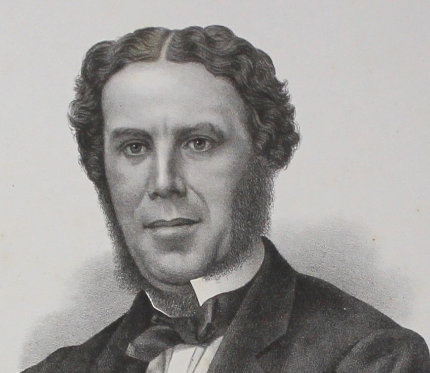 A man in head and shoulders profile with a three piece suit on and black bow tie