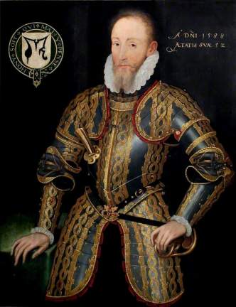 A portrait of a white man wearing decorated armour. It is black with a gold pattern. The background is plain black. His right hand is leaning on a table.