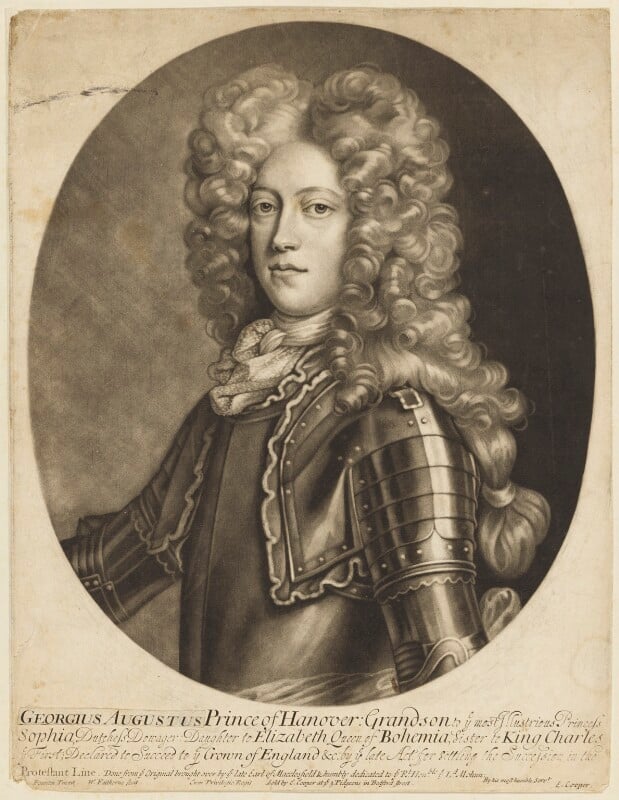 A half length black and white portrait on aged paper of George Augustus, Prince of Hanover (duke of Cambridge and then King George II). In an oval frame, he is wearing armour, a breastplate and shoulder plates, with a frilled necktie, He is clean shaven, a young face, with long curly ringleted hair.