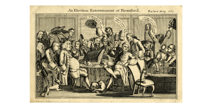 Engraving showing a group of men wearing wigs and frock coats enjoying a feast. Two women are serving them and a dog is shown eating a bone at one of their feet.